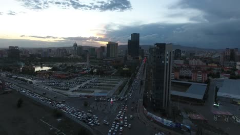Beautiful-sunset-in-Ulan-bator-traffic-and-buildings-aerial-drone-shot